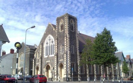 Exterior of Tabernacle Cardiff, Pen-y-Wain Road, Roath, Cardiff. Blue sky with dappled white cumulo-stratus cloud. Tree in full leaf.