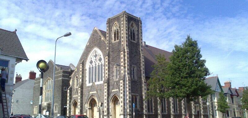 Exterior of Tabernacle Cardiff, Pen-y-Wain Road, Roath, Cardiff. Blue sky with dappled white cumulo-stratus cloud. Tree in full leaf.
