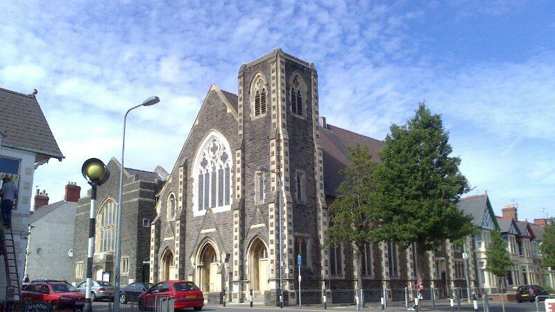 Exterior of Tabernacle Cardiff, Pen-y-Wain Road, Roath, Cardiff. Blue sky with dappled white cumulo-stratus cloud. Tree in full leaf.
